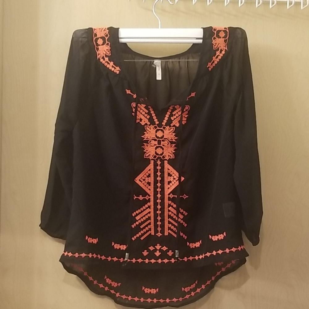 Nice blouse with orange embroidered design